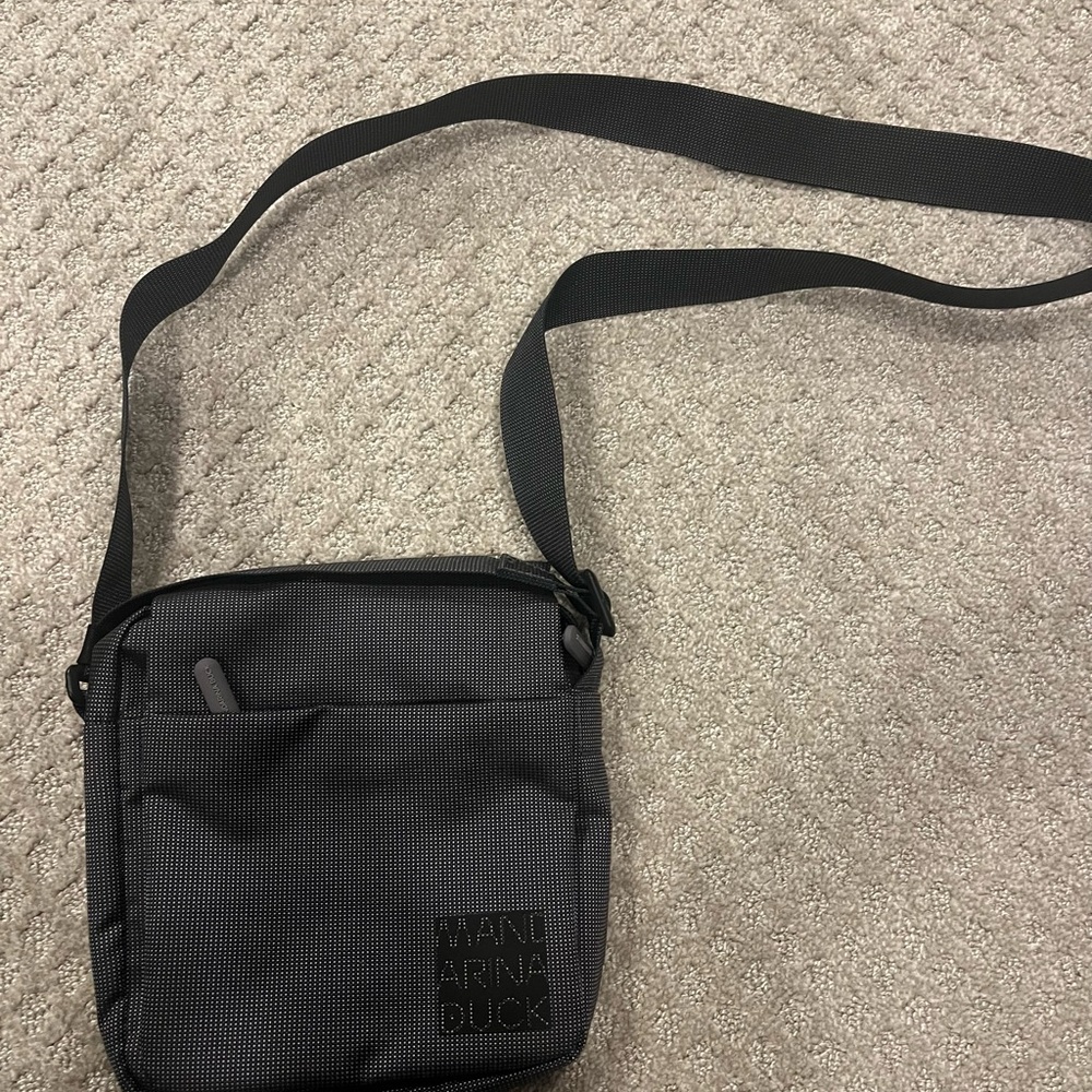Black Messenger Bag with Adjustable Strap and Durable Material